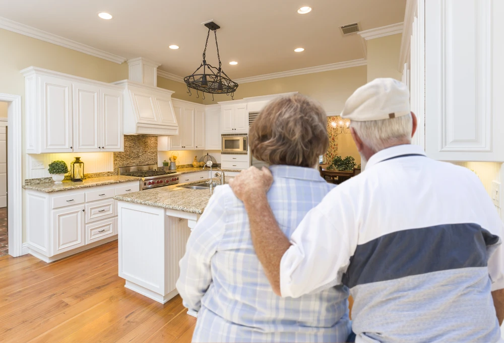 elderly-couple-looking-at-renovated-home