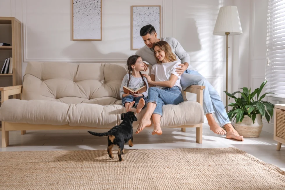 Family in Northern VA relaxed on couch in their updated home